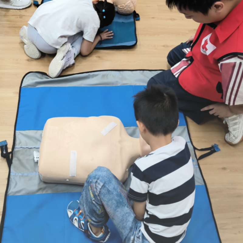 Children practising first aid skills