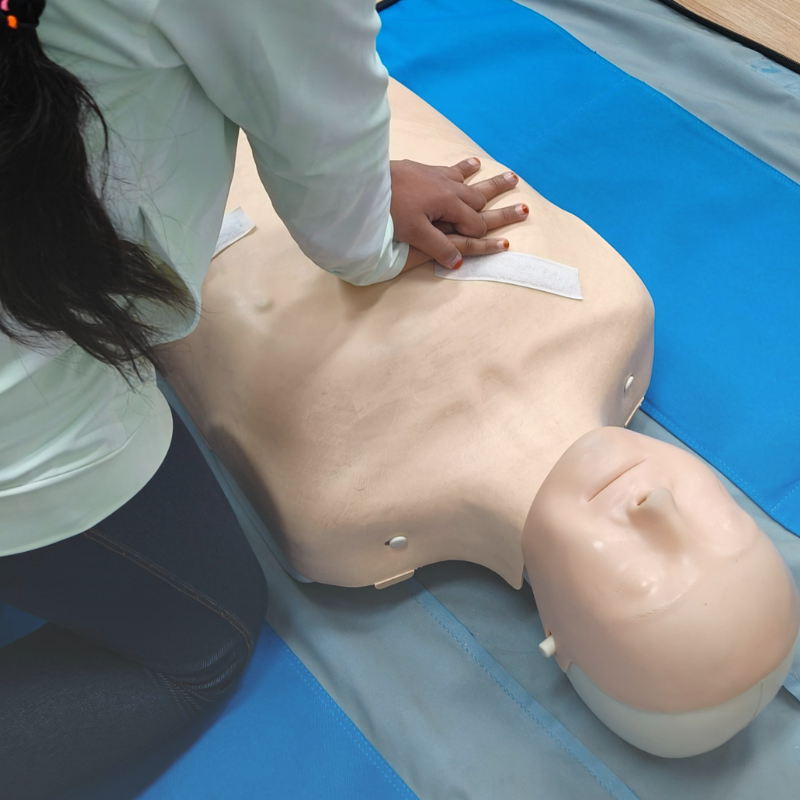 Instructor guiding children during workshop