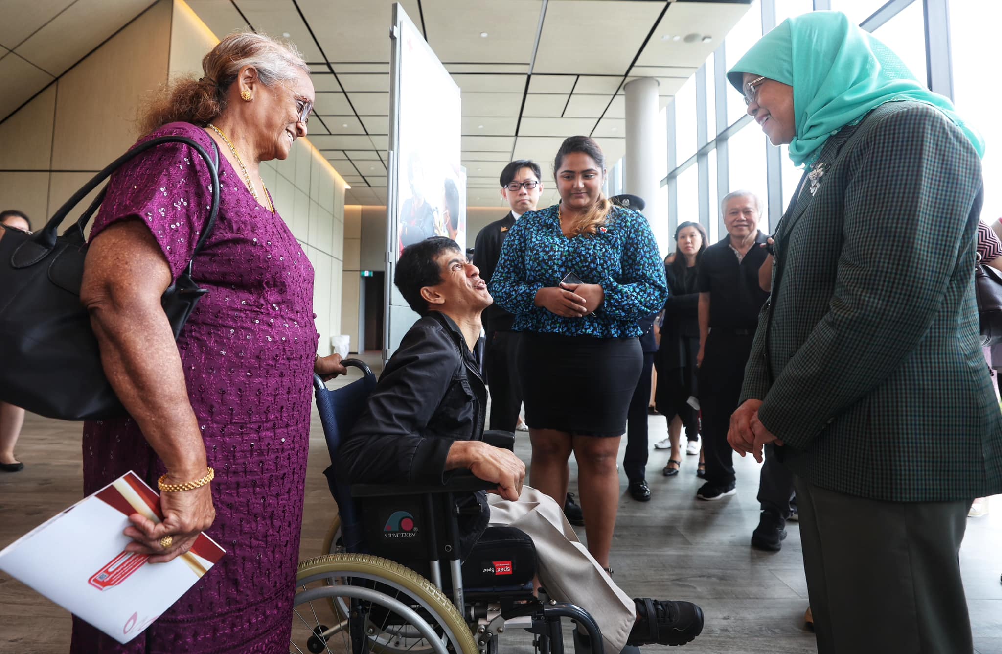 Vicky and his mother at Singapore Red Cross Awards 2022